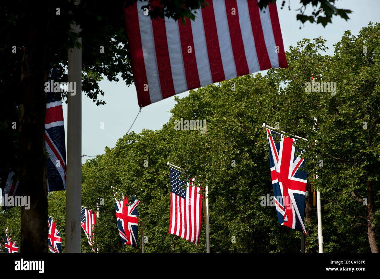 Stars and Stripes and Union Jack flags line the Mall looking towards Buckingham Palace Stock Photo