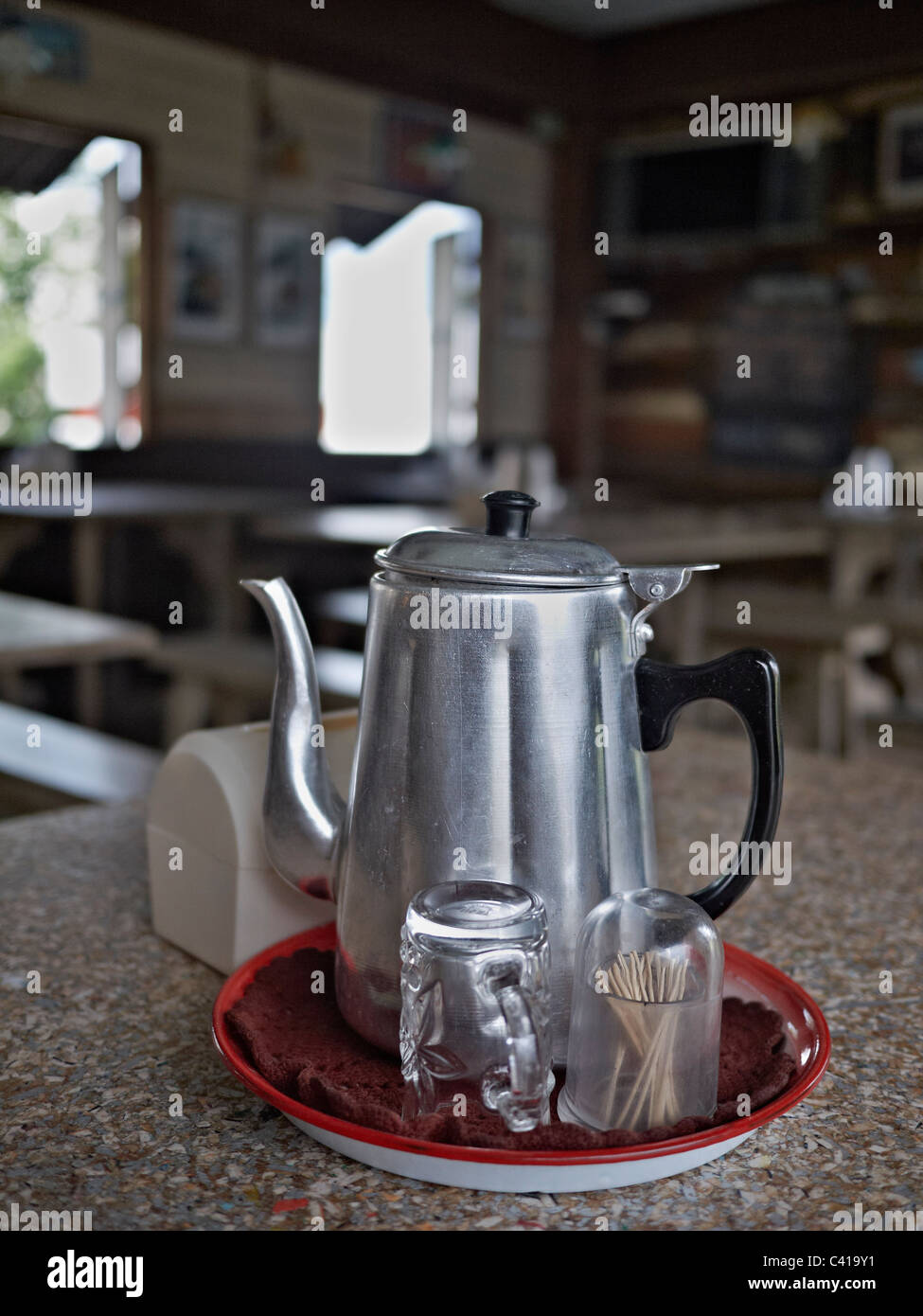 Old metal teapot used as a water jug Stock Photo Alamy