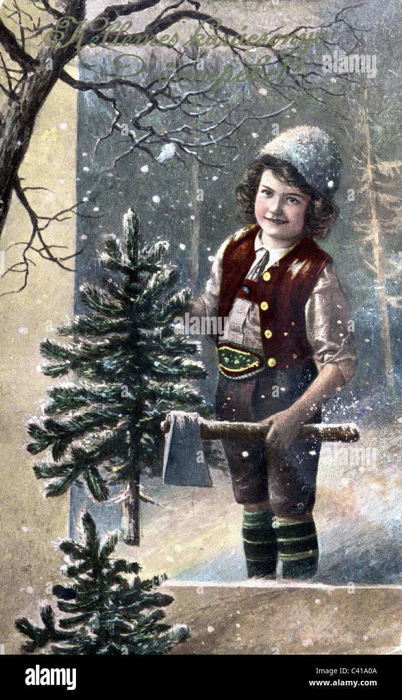 Christmas, young boy with axe and Christmas tree, picture postcard, circa 1910s, , Additional-Rights-Clearences-Not Available Stock Photo