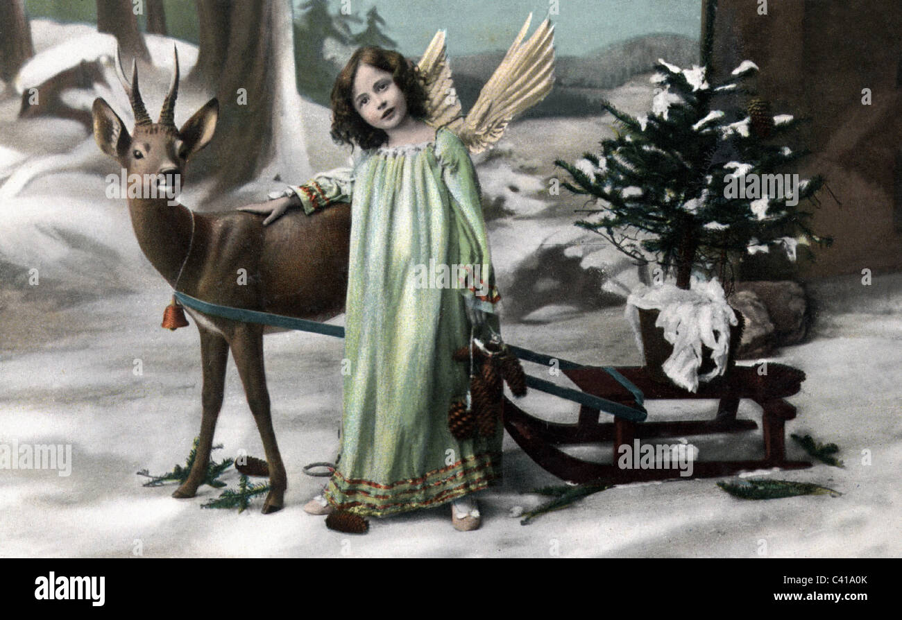 Christmas, little girl as angel with roe deer sleigh and Christmas tree, postcard, coloured, early 20th century, kitsch, forest, wood, sled, sledge, child, kid, children, kids, wings, people, historic, historical, nostalgia, 1900s, 1910s, Additional-Rights-Clearences-Not Available Stock Photo