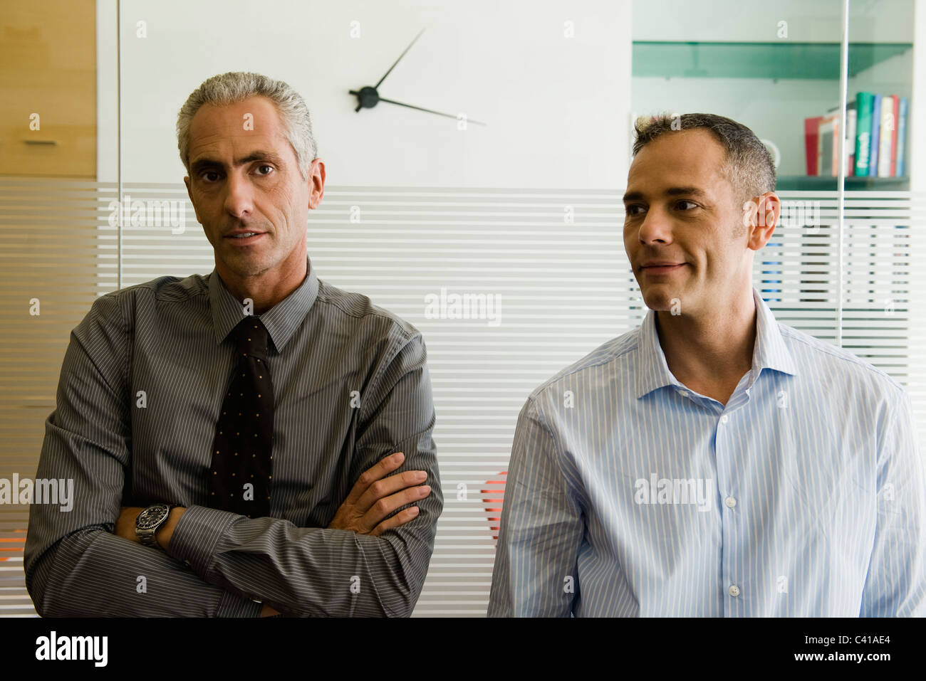 Businessmen standing side by side in office, portrait Stock Photo - Alamy
