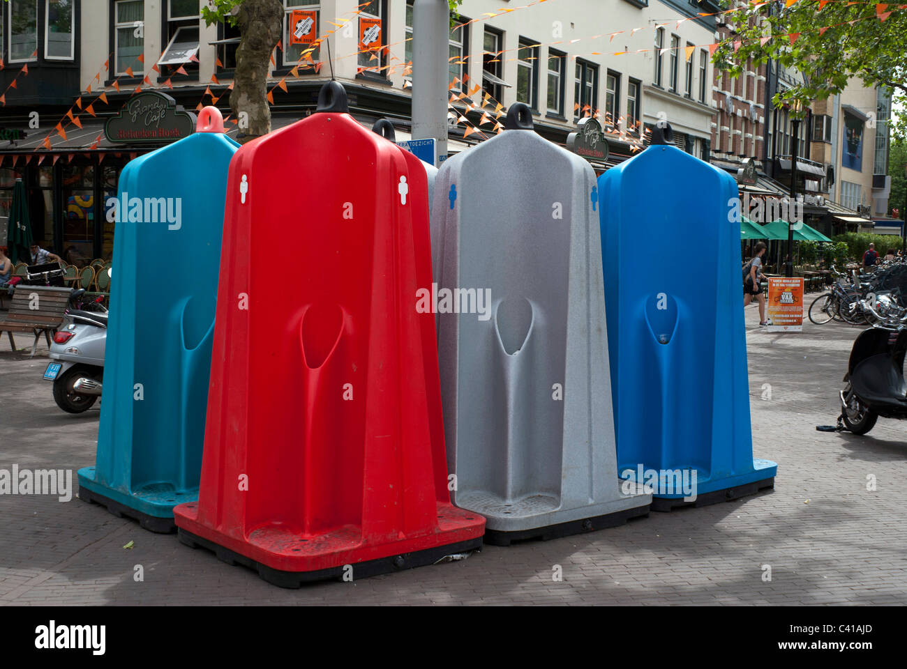 Brightly coloured urinals in a square in Amsterdam, Netherlands Stock