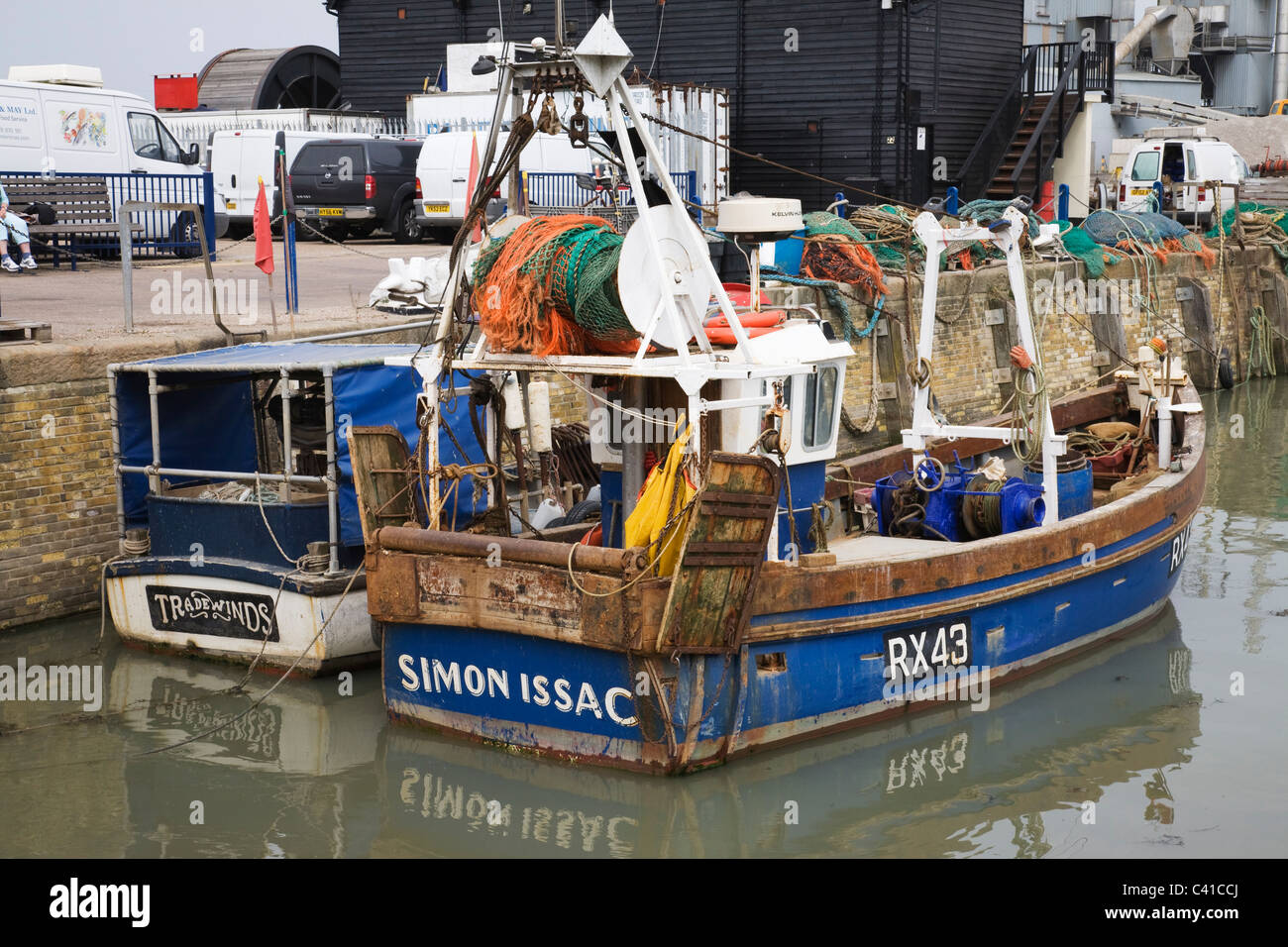 Two fishing boats moored in Whitstable harbour, Kent, England, UK. Stock Photo