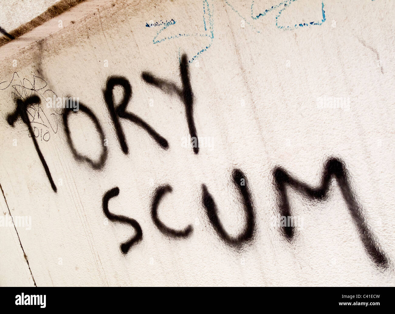 Tory Scum anti conservative party graffiti spray painted on to a wall in Britain Stock Photo