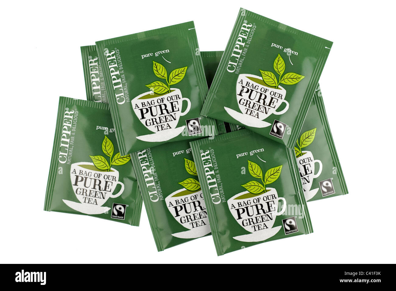 Pile of nine fairtrade Clipper sachet enveloped bags of pure green tea Stock Photo