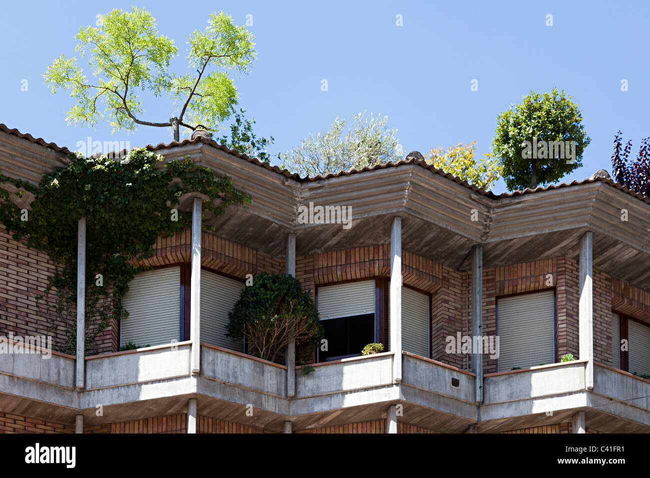 Balconies with plants and trees growing on roof Olot Garrotxa Catalunya Spain Stock Photo