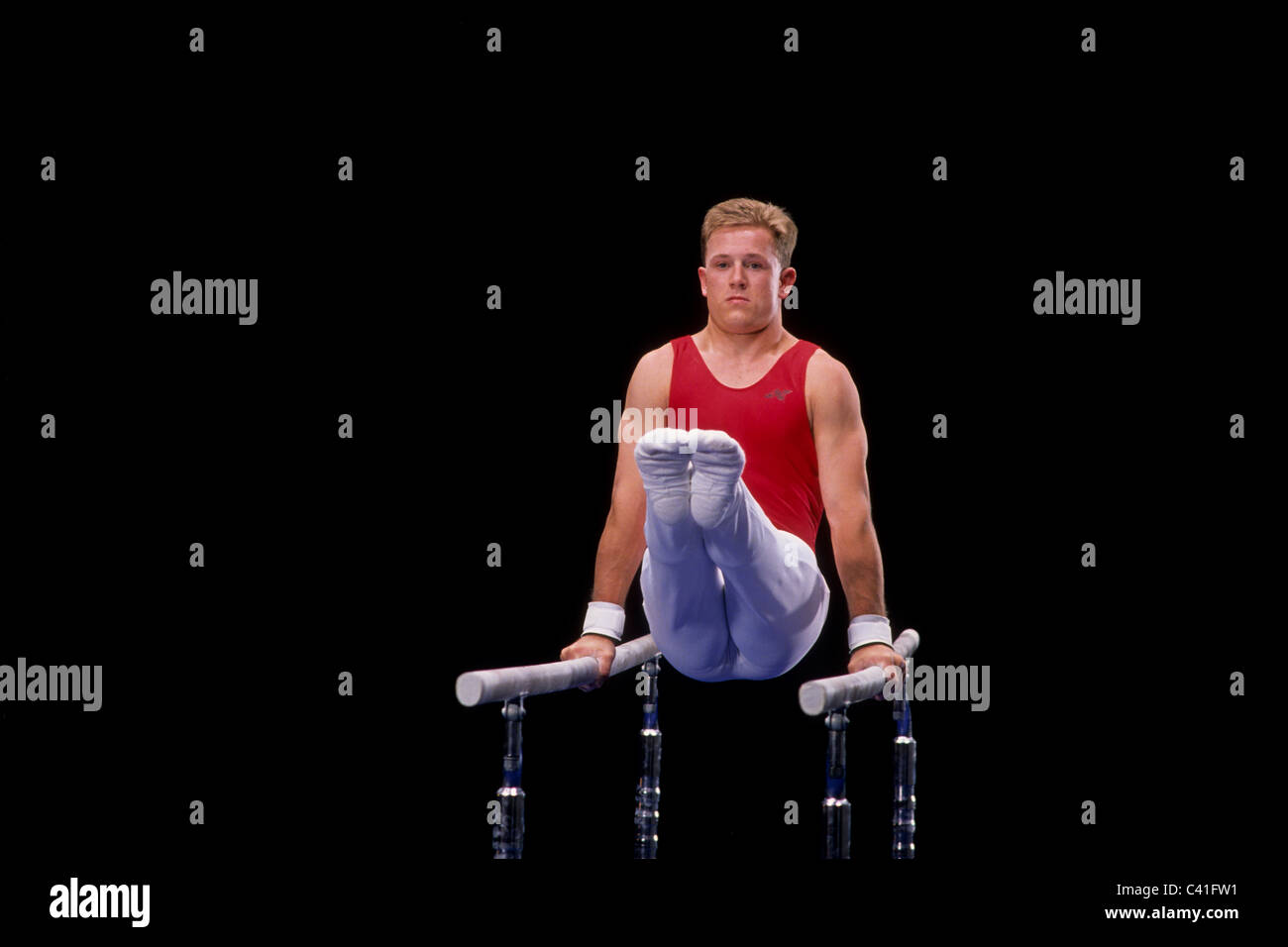 Male gymnast on the parallel bars Stock Photo Alamy