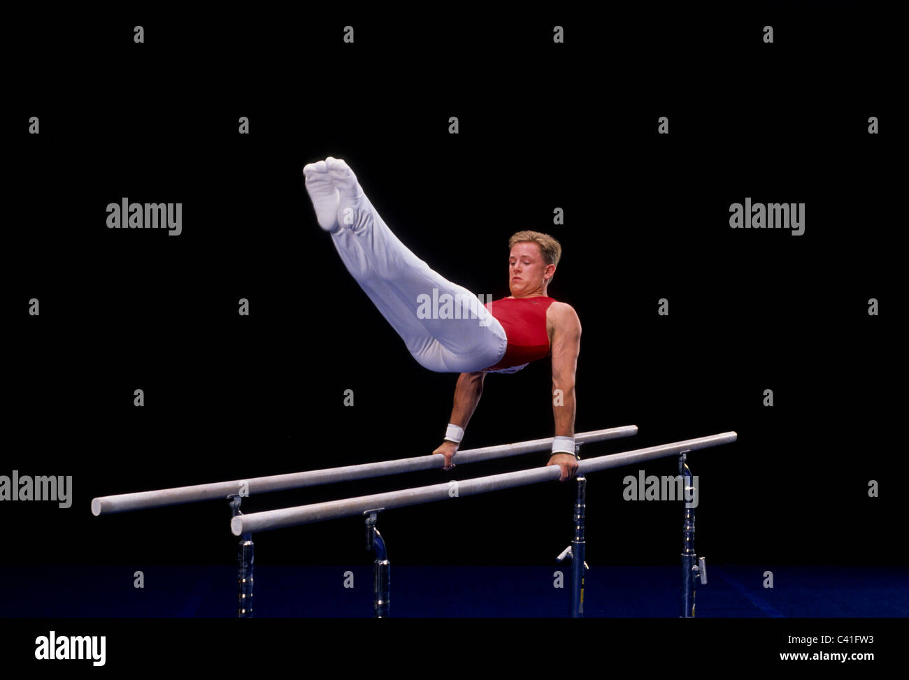 Male gymnast on the parallel bars Stock Photo Alamy