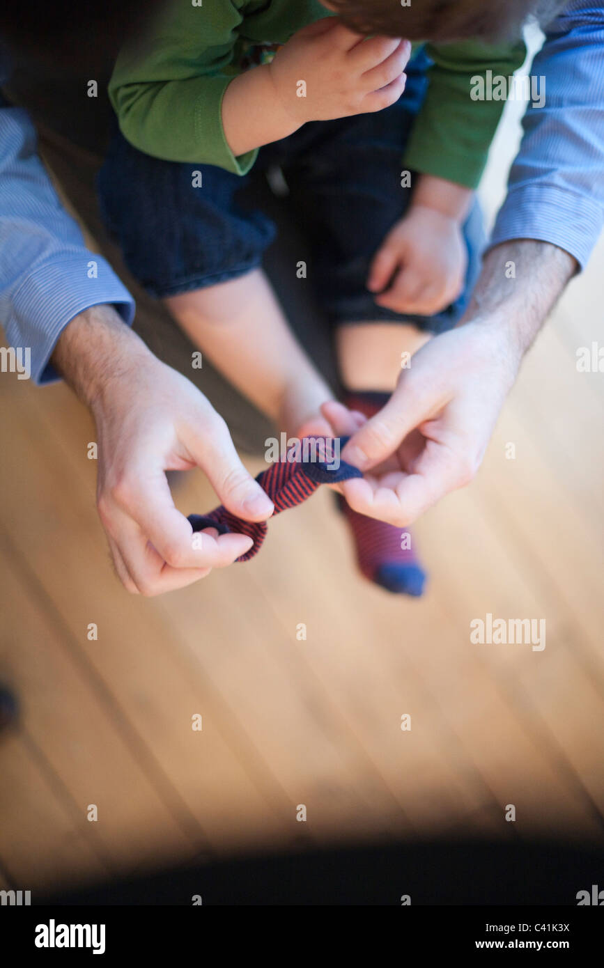 Kid putting on socks hires stock photography and images Alamy