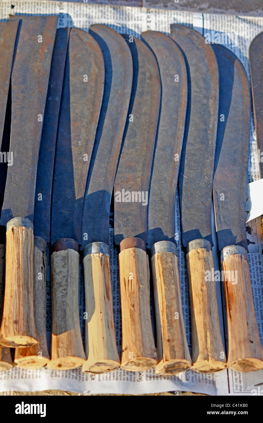 Close up of sickles for sell at market, India Stock Photo