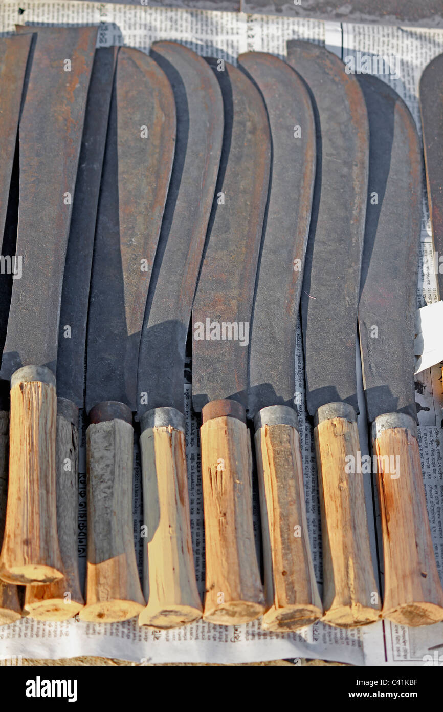 Close up of sickles for sell at market, India Stock Photo