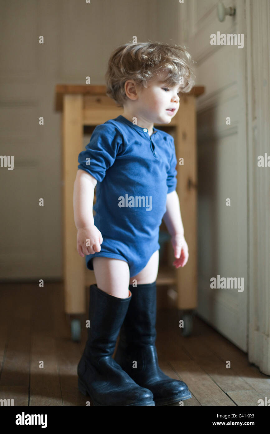Young boy wearing rubber boots hires stock photography and images Alamy