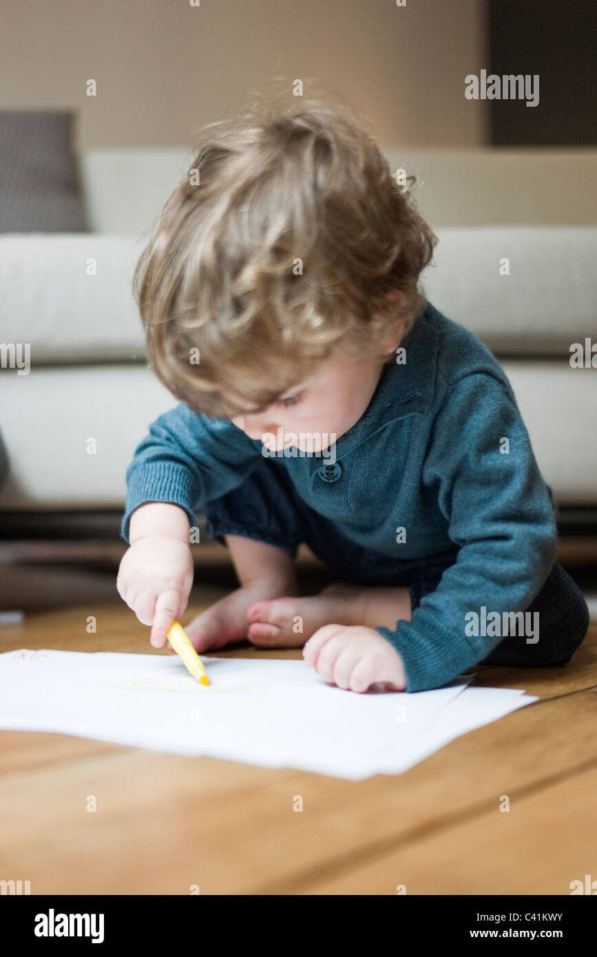 Boy Drawing On Paper With Pen Stock Photos & Boy Drawing On Paper With