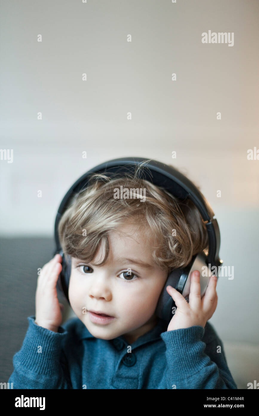 Toddler boy wearing headphones, portrait Stock Photo Alamy