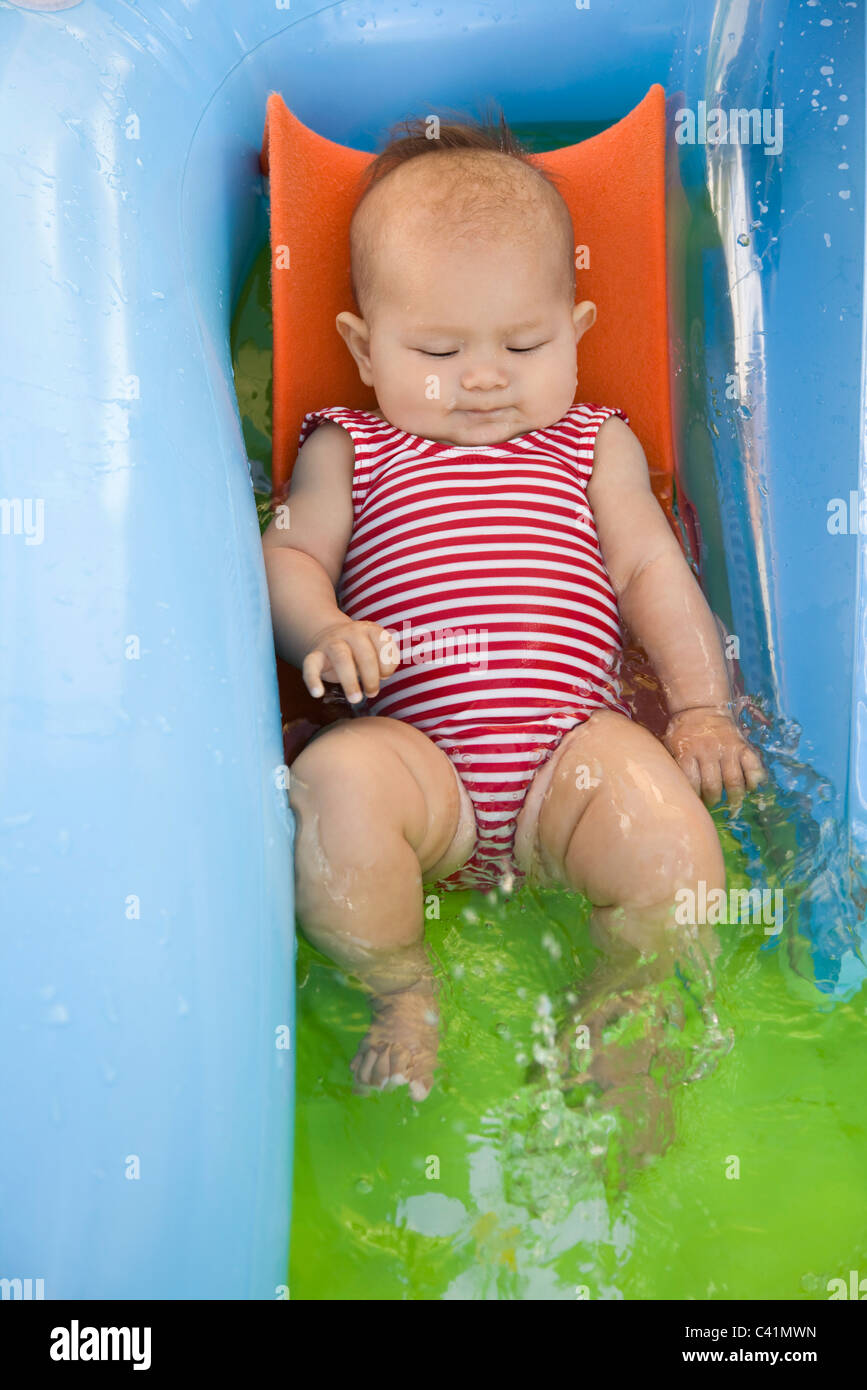 Baby playing in kiddy pool, portrait Stock Photo Alamy
