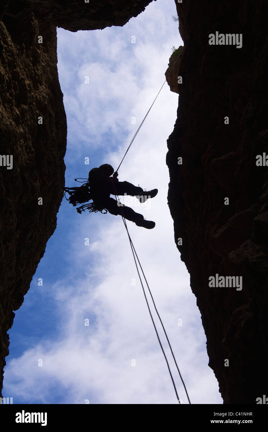 climber descending with the technique of rappelling Stock Photo - Alamy