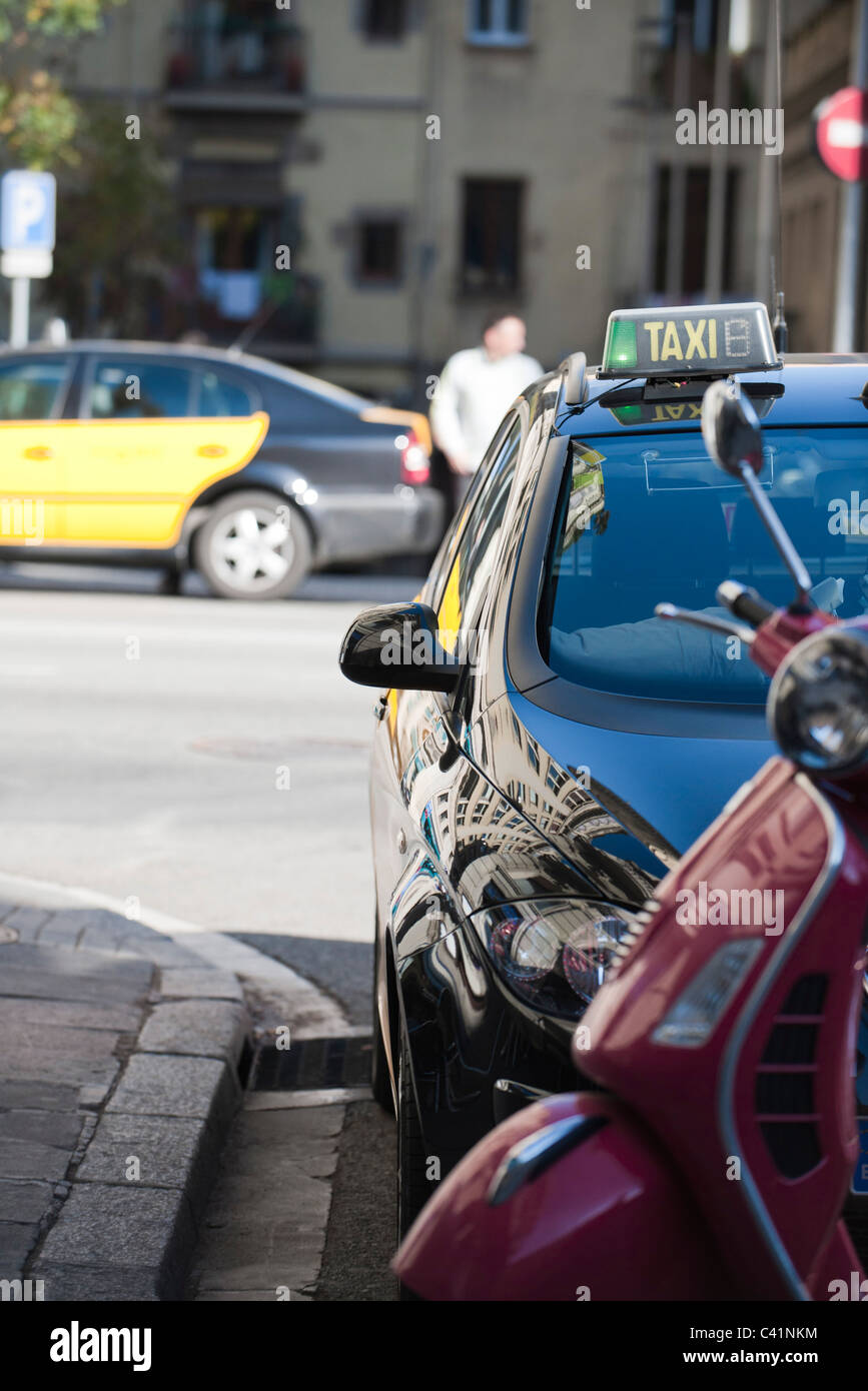 Taxi parked along curb Stock Photo