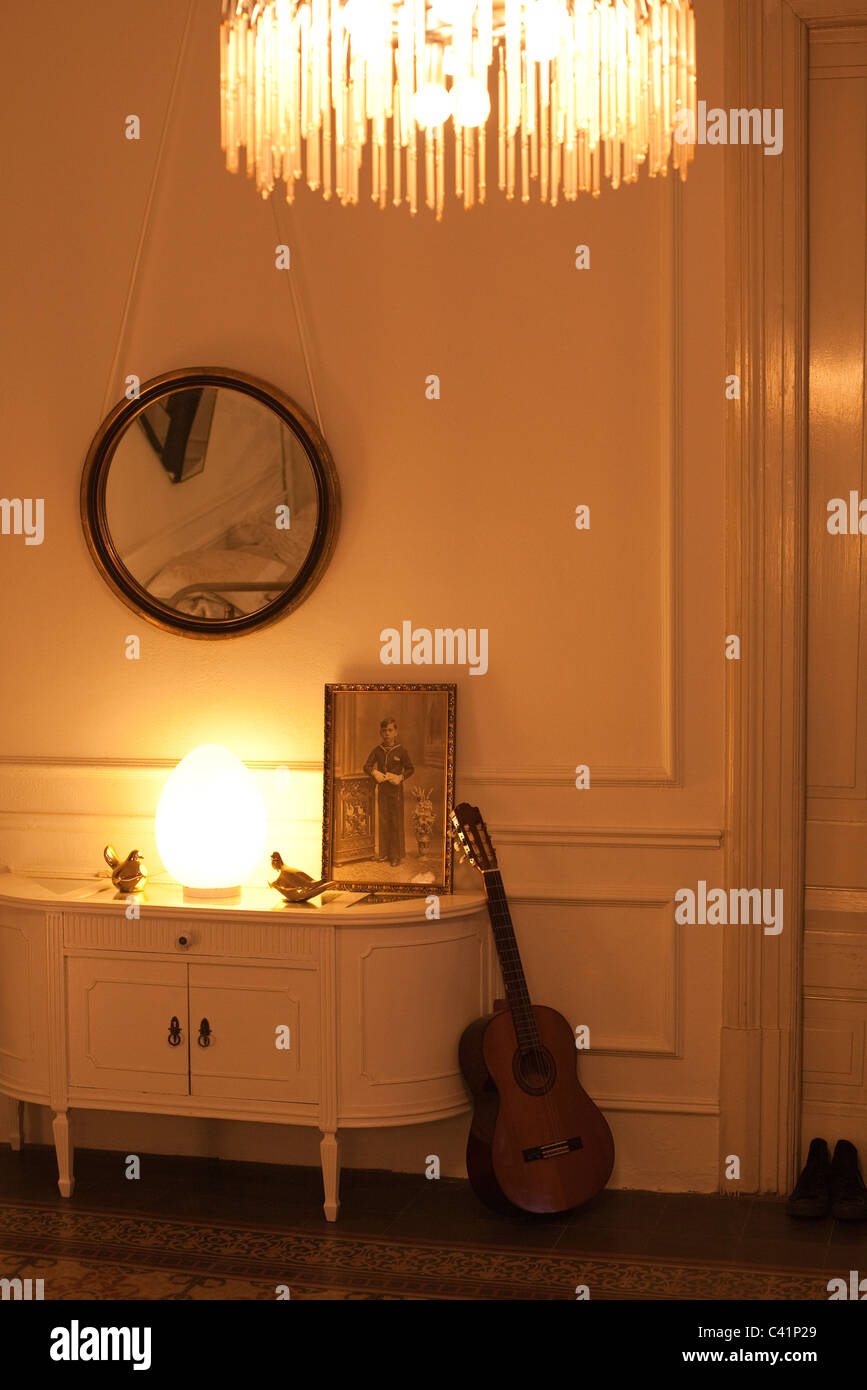 Home interior lit by lamp and chandelier Stock Photo Alamy