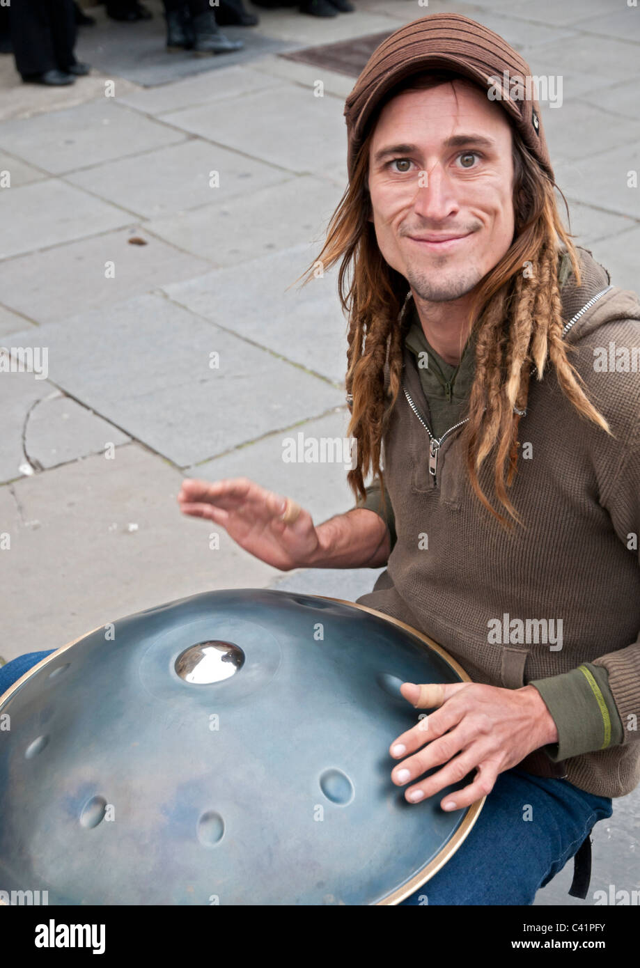 A musician playing the instrument called the Hang, which originates from  Switzerland on the streets of Bath Stock Photo - Alamy