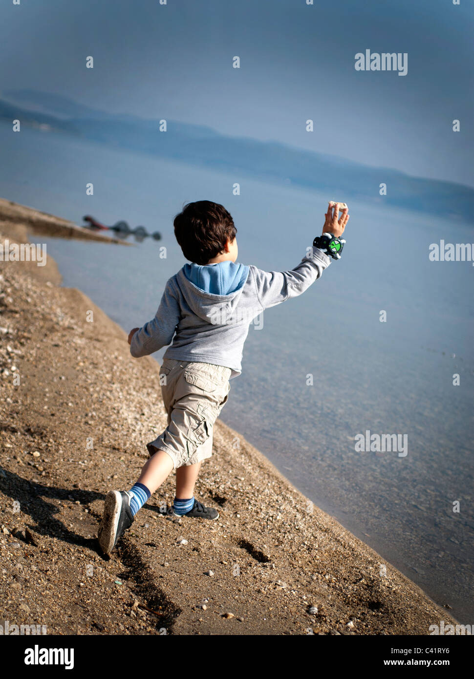 Boy throwing rocks hires stock photography and images Alamy
