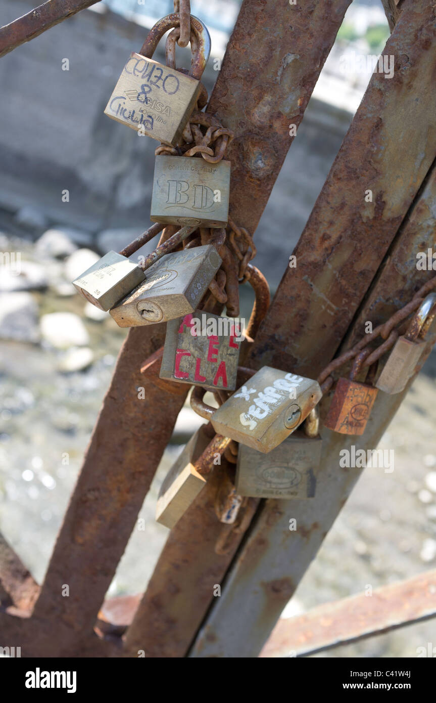 Padlock love tokens attached to the guard rails on the seafront at Maiori (SA), Amalfi Coast, Italy Stock Photo