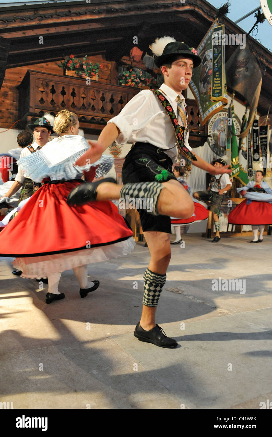 dancer in traditional costumes show the famous dance 'Schuhplattler' in Bavaria, Germany Stock Photo