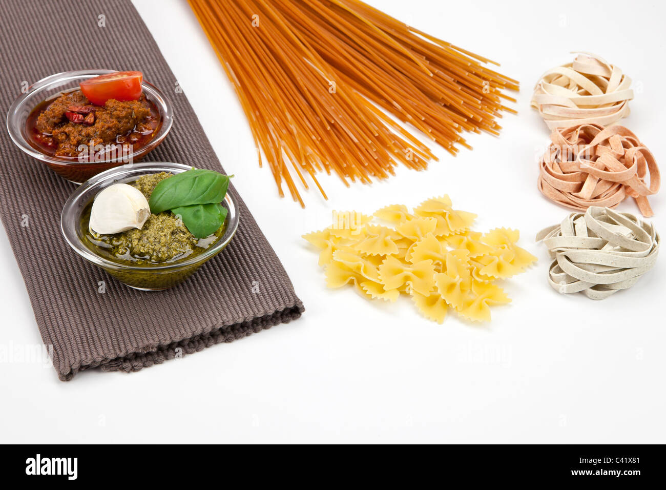 different kinds of pasta with pesto two different varieties Stock Photo