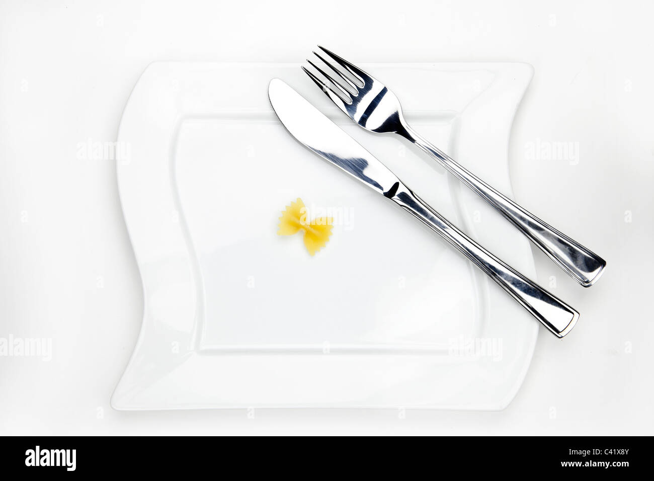 Farfalle one on a white plate Stock Photo