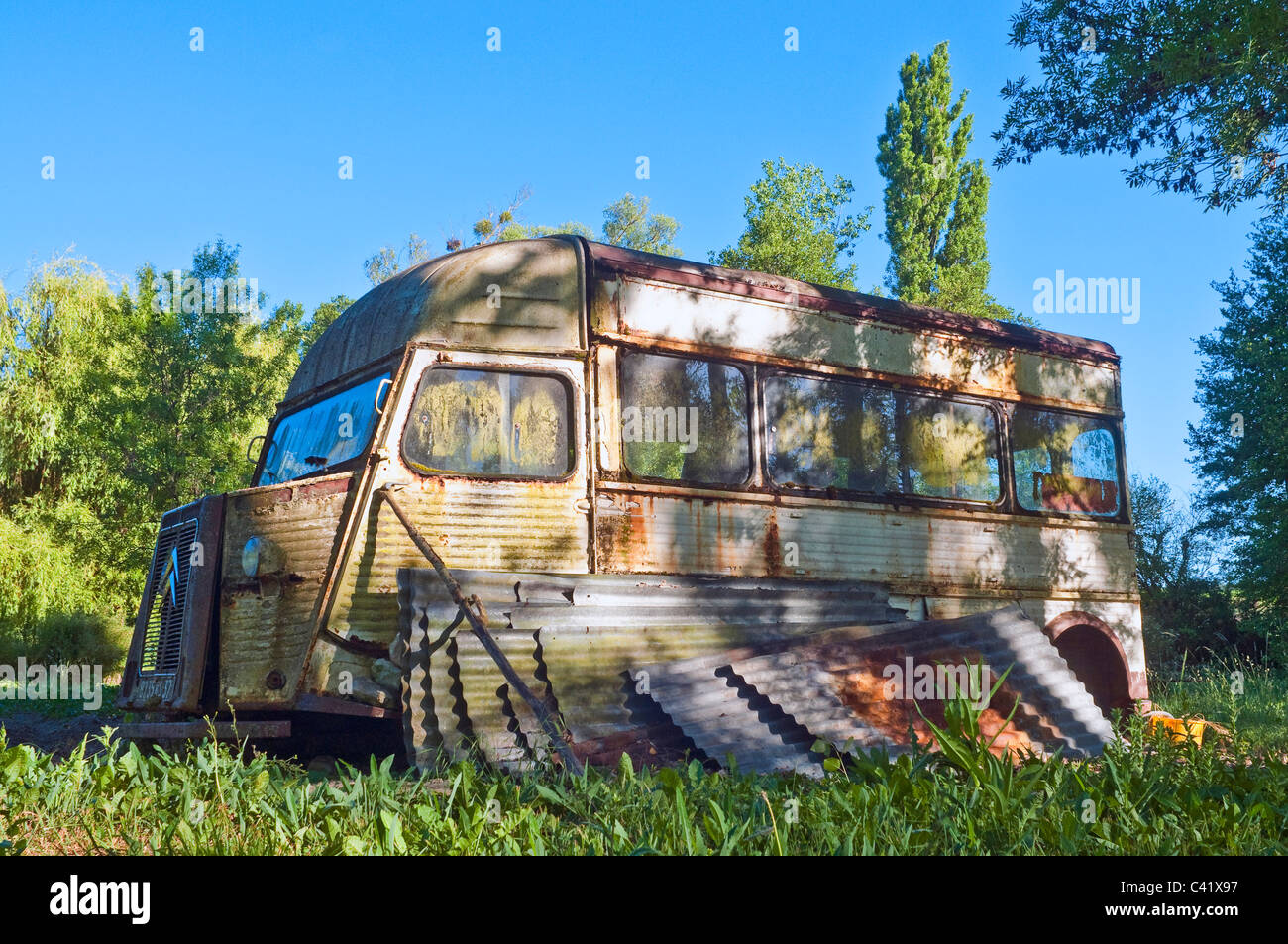 French corrugated metal Citroen H Van used as shed - sud-Touraine, France. Stock Photo