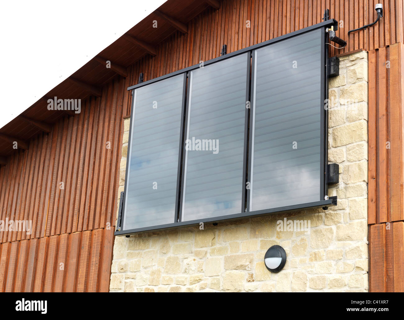 solar panels on side of new building Stock Photo
