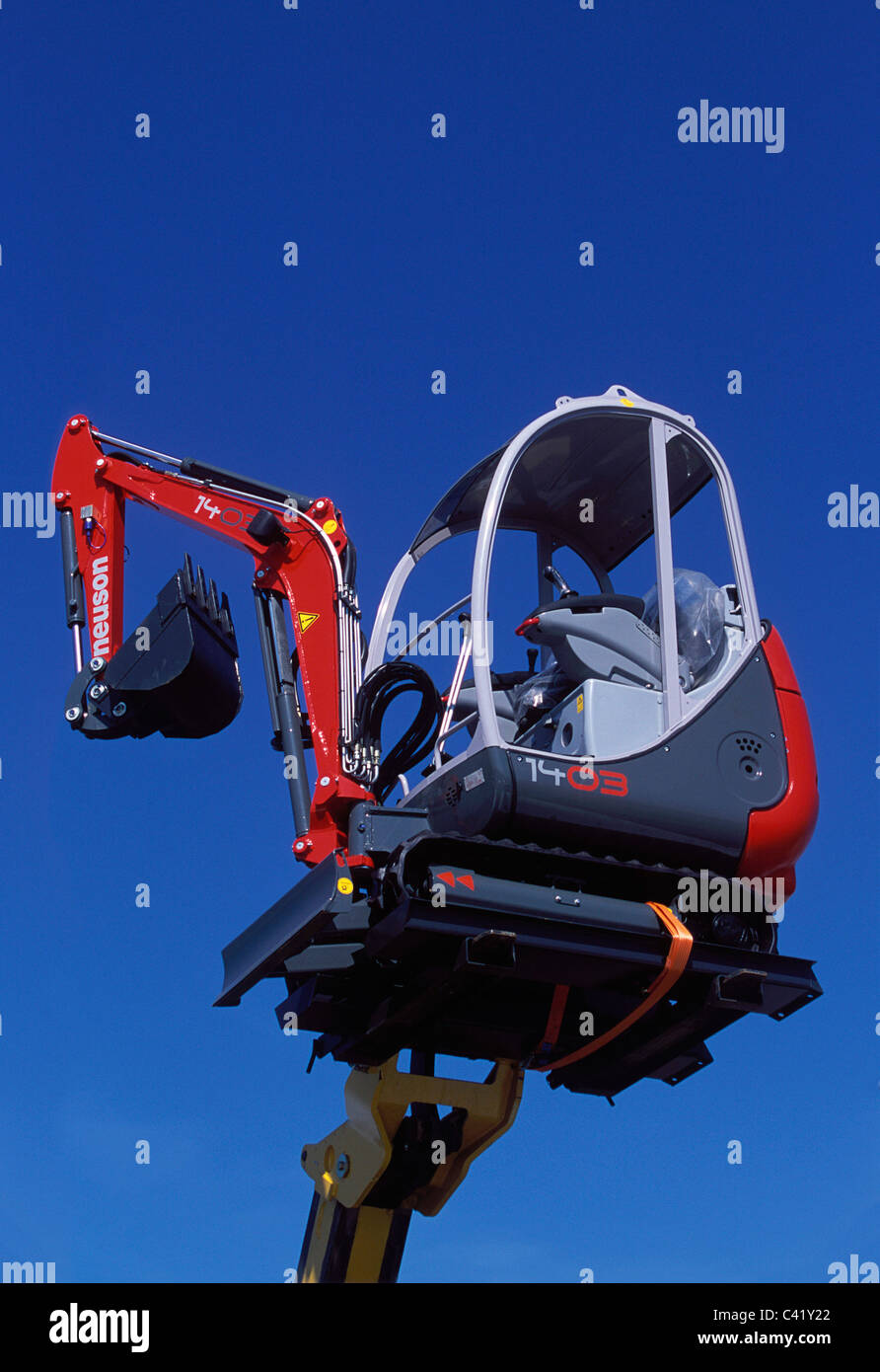 Neuson Kramer 1403 mini excavator raised on boom of telescopic forklift  Stock Photo - Alamy