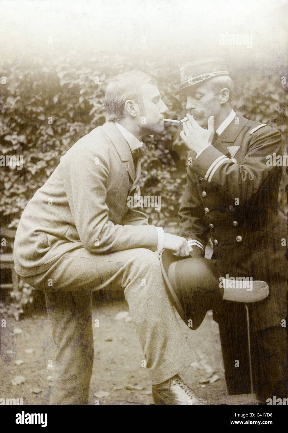 people, men, man getting a light for his cigarette from an official or military officer, Austria, circa 1910, Additional-Rights-Clearences-Not Available Stock Photo