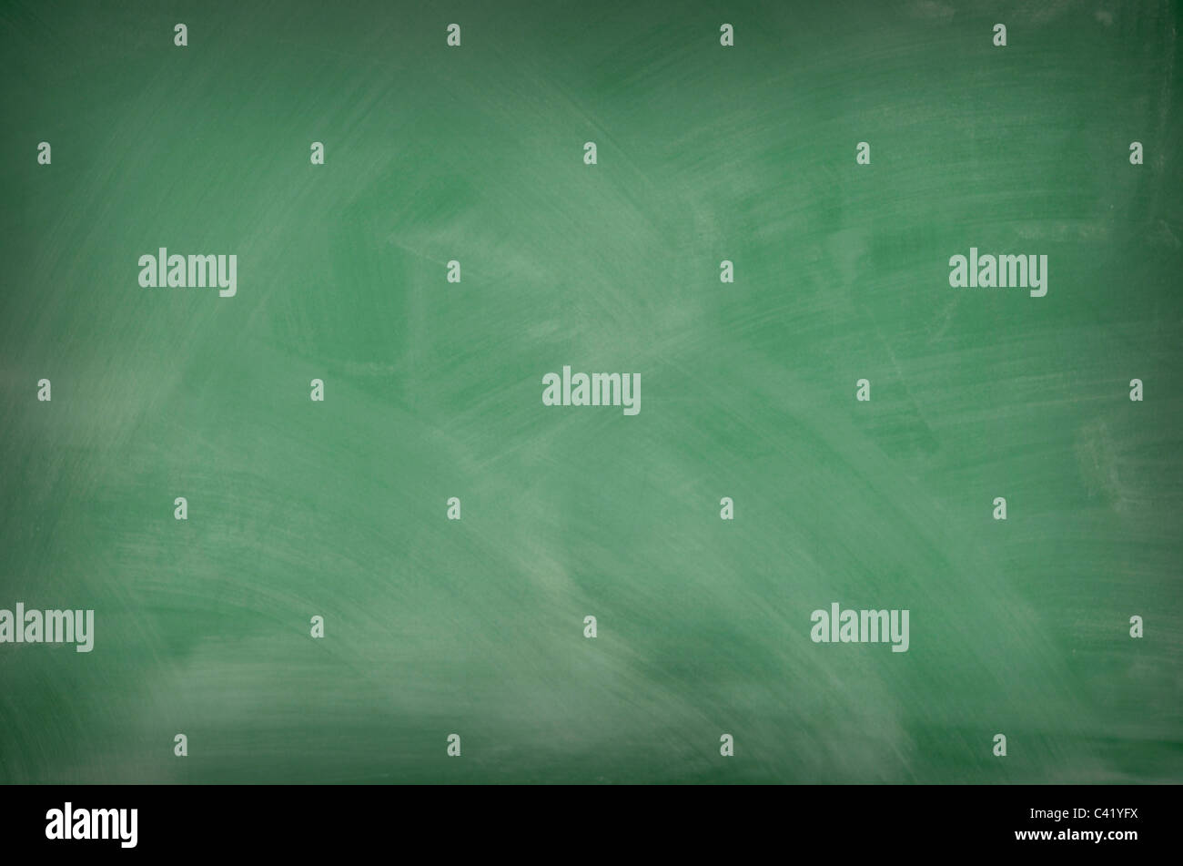 Green chalkboard with smeared chalk eraser marks Stock Photo