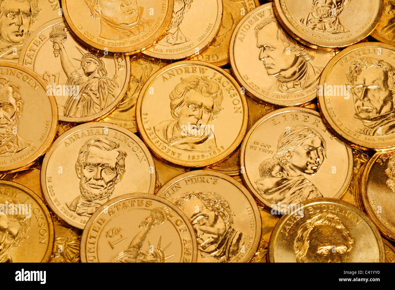 Layer of gold one dollar U.S. Presidential coins Stock Photo