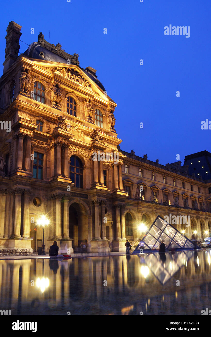 The Louvre Museum at night Stock Photo