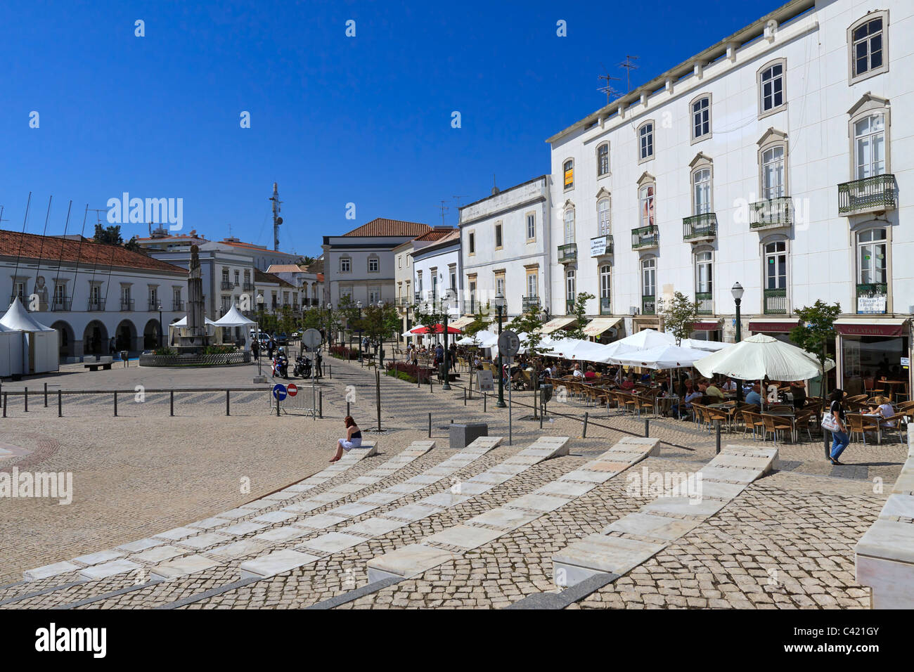Praca da Republica, main public square in Tavira, Algarve, Portugal. The square is lined with shops and cafes. Stock Photo