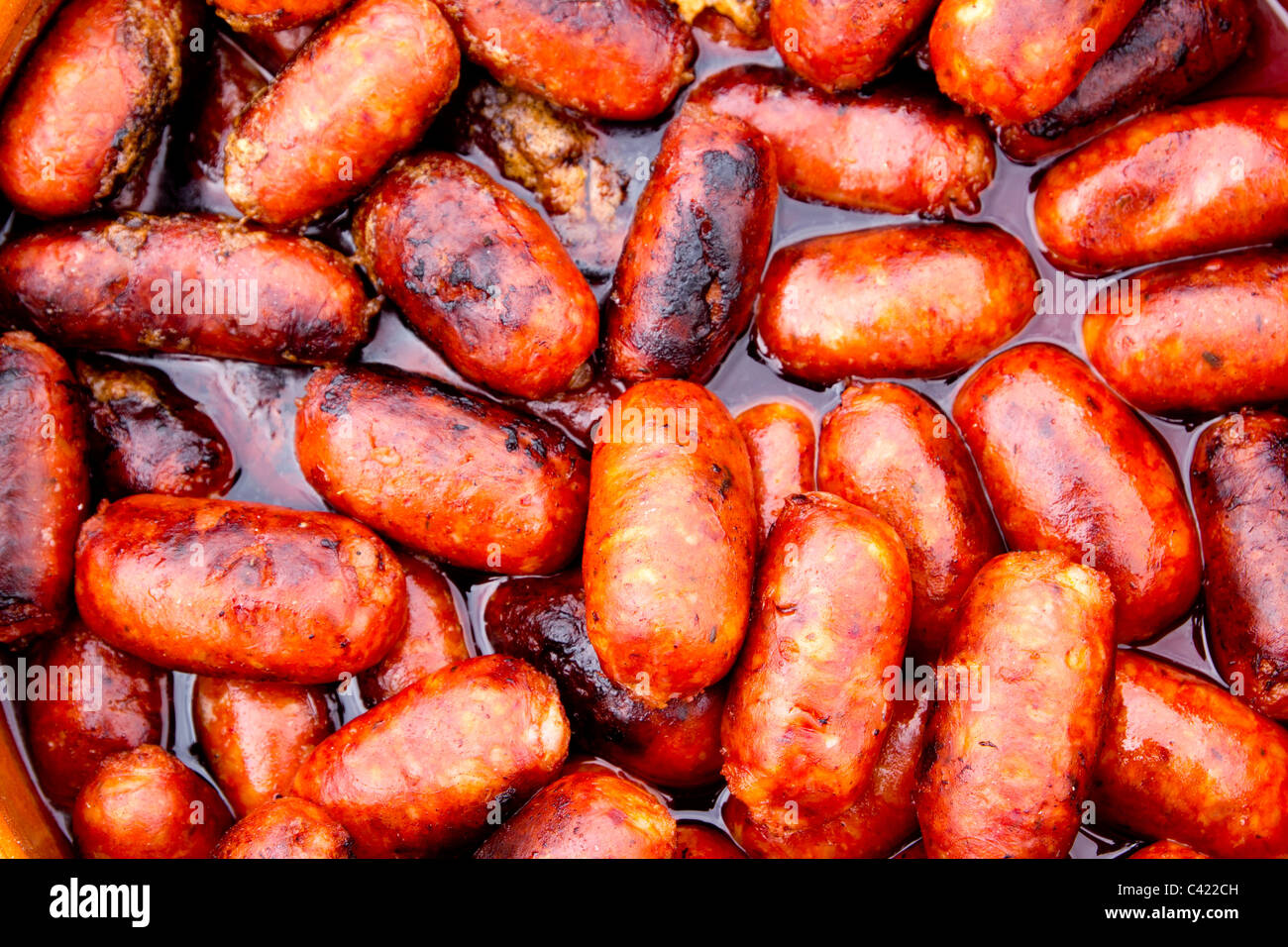chorizo red sausages fried in oil Spain unhealthy food Stock Photo Alamy
