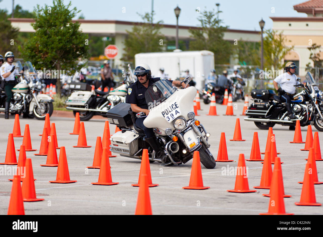 Law enforcement motorcycle teams compete on a cone course at the Bruce Rossmeyer Harley Davidson Center in Daytona, Florida, USA Stock Photo