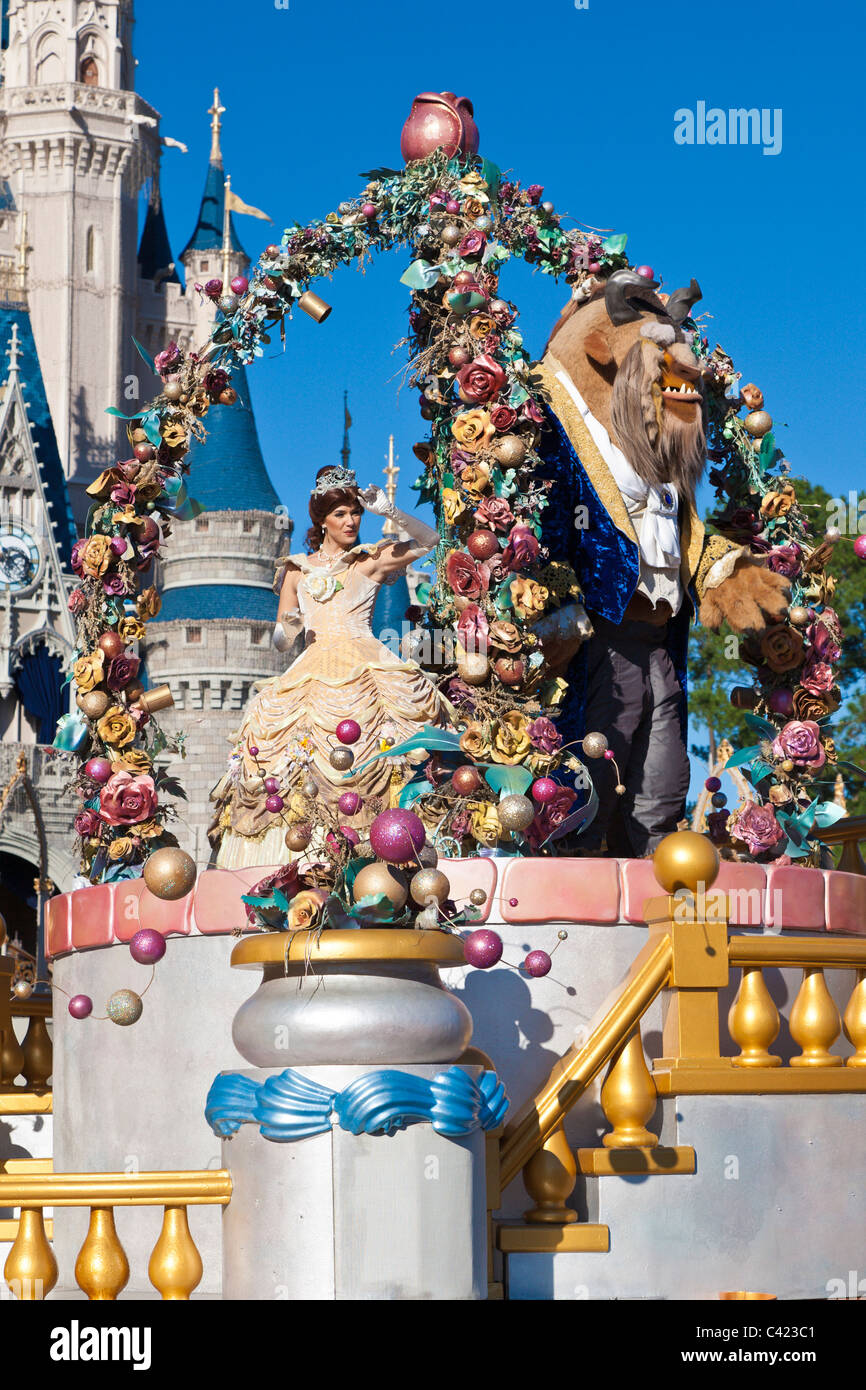 The Beauty and the Beast riding a float in 'A Dream Come True' parade at the Magic Kingdom in Disney World, Kissimmee, Florida Stock Photo