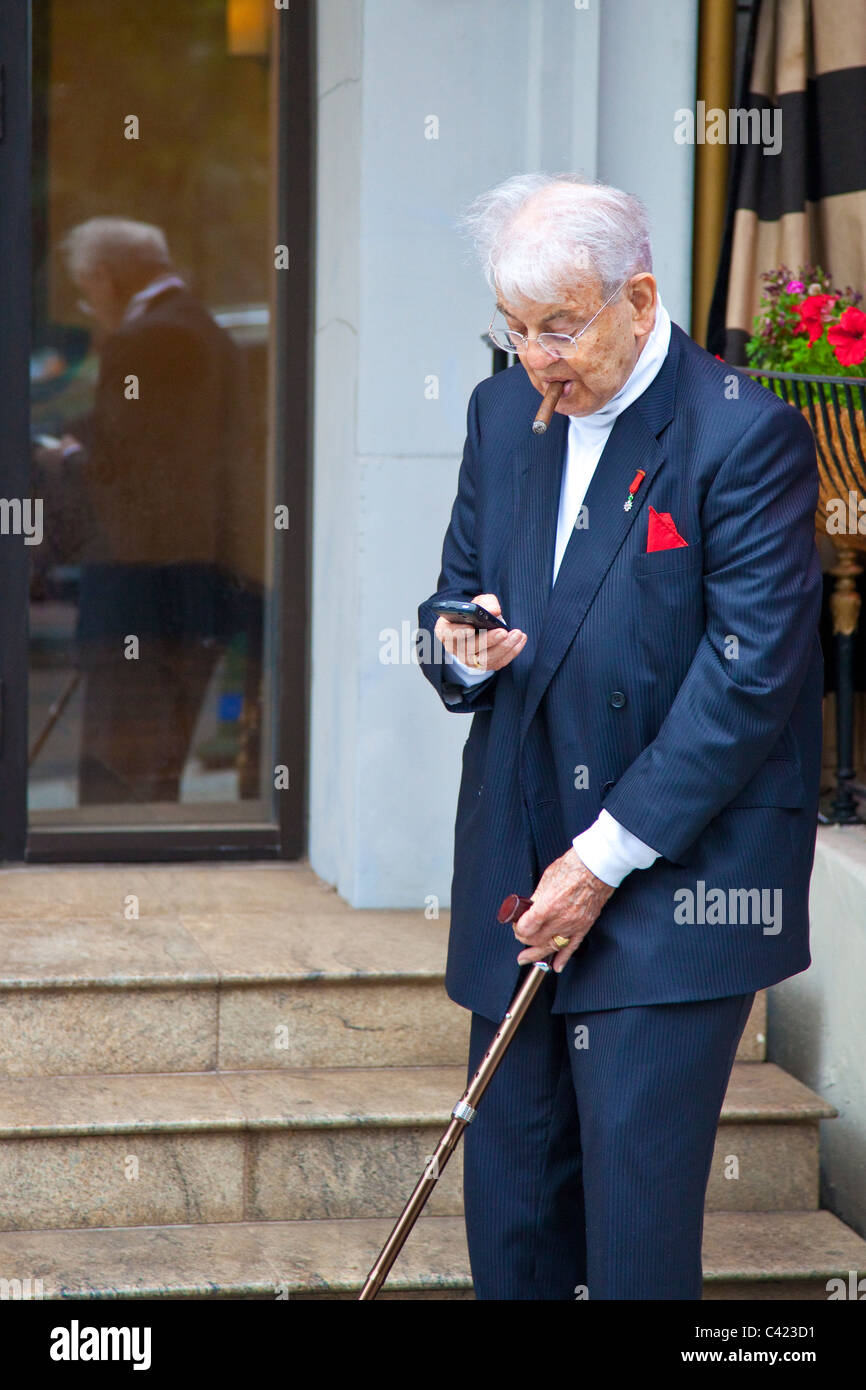 Wealthy elderly man using a Blackberry in Washington DC Stock Photo
