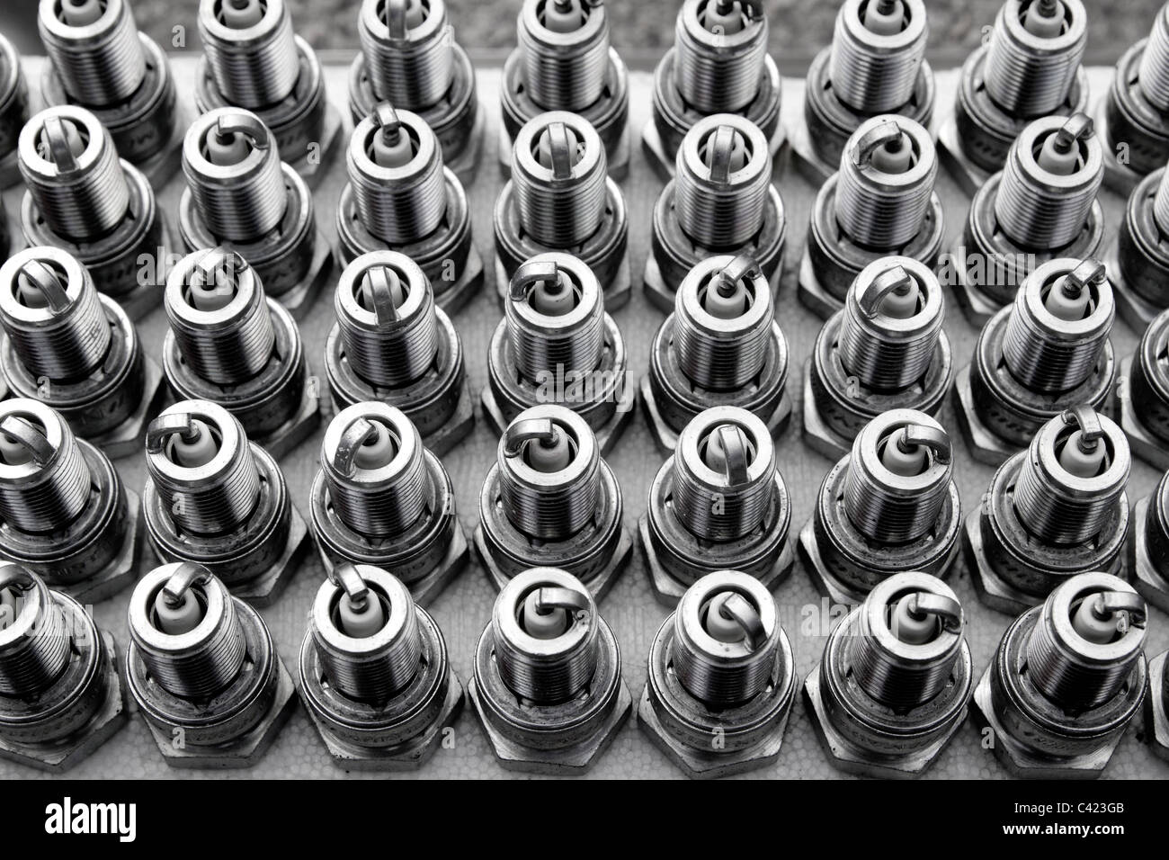 car spark plugs rows pattern mechanical engine pieces new Stock Photo Alamy