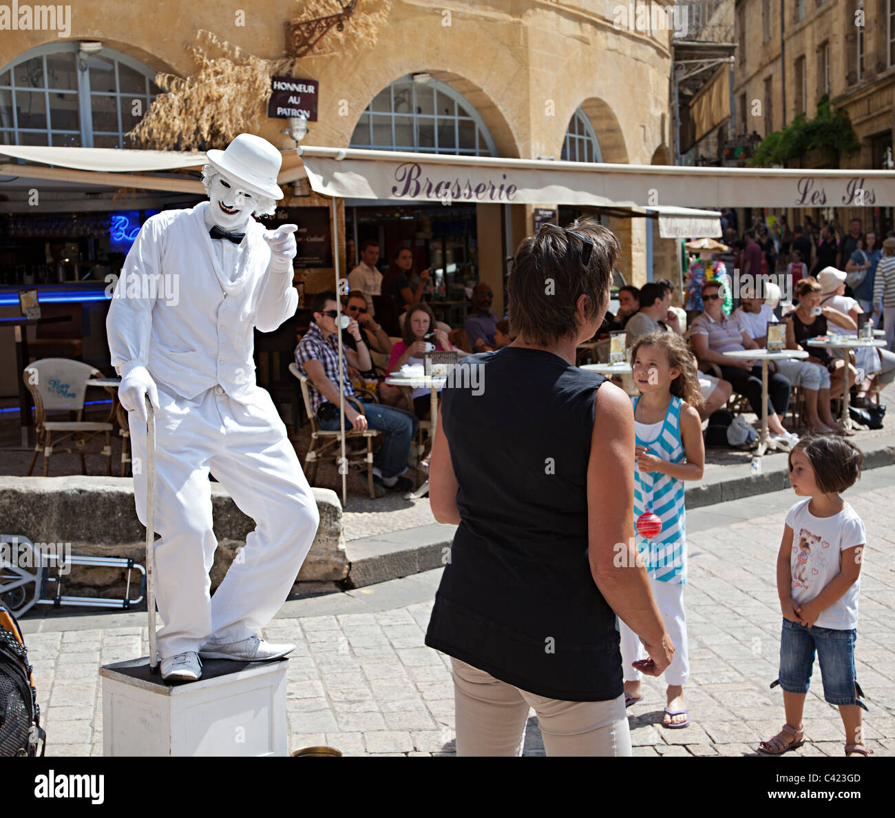 Living statue Charlie Chaplin France pointing at woman ignoring him Stock Photo