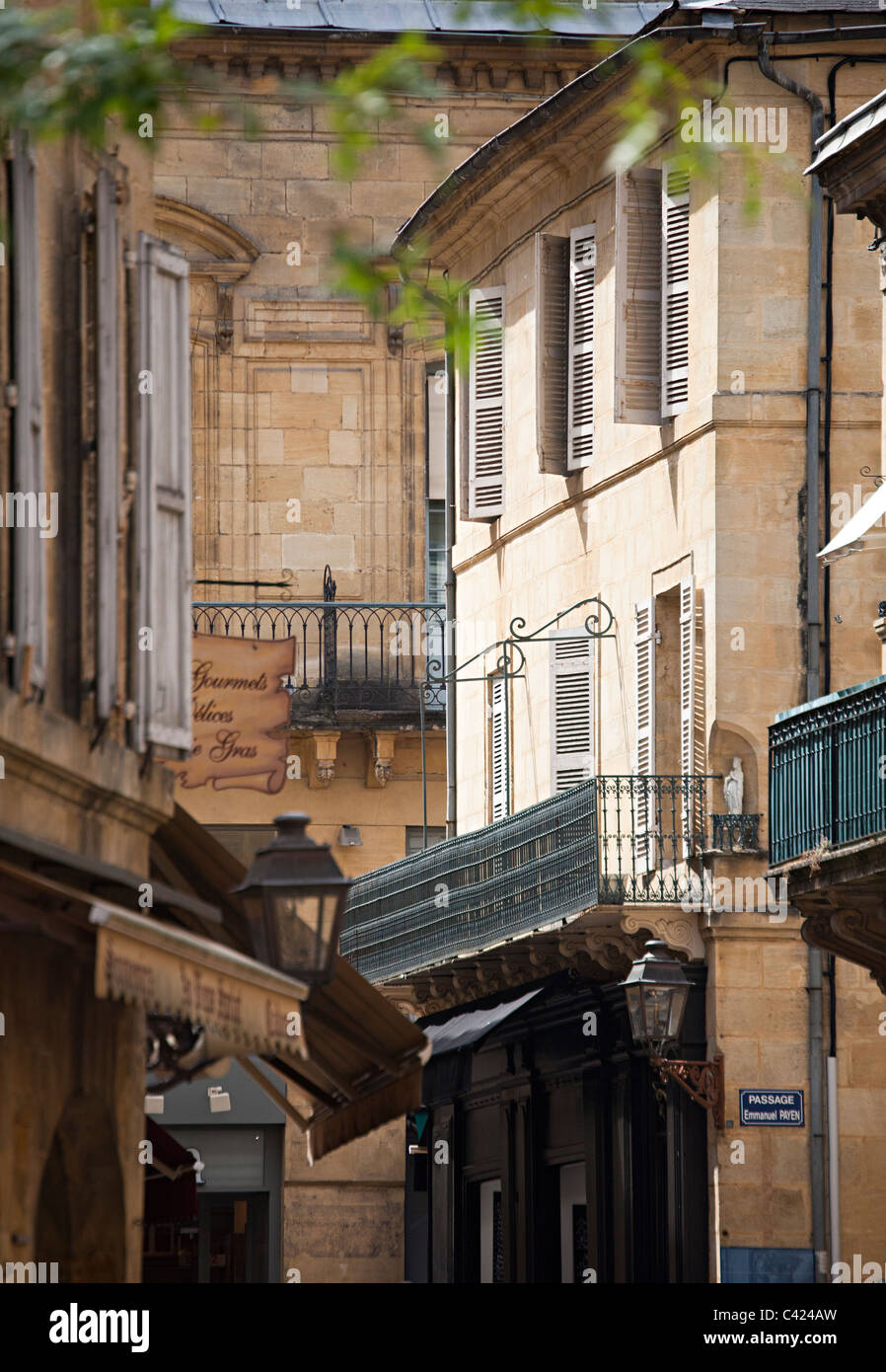 Balconies and windows above shops Sarlat-la-Caneda Dordogne France Stock Photo