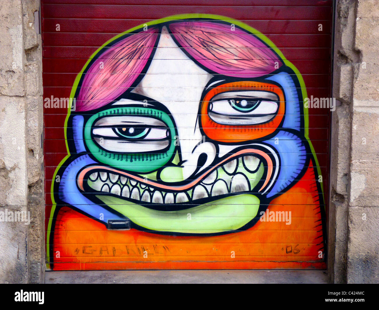 Urban art: Graffiti painted on private doorway in Valencia Spain Stock Photo