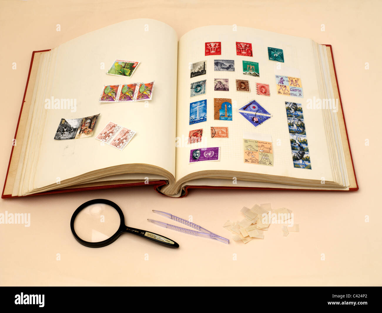 Stamp Collecting Stamp Album Tweezers Magnifying Glass Stamp Hinges and Stamps Stock Photo