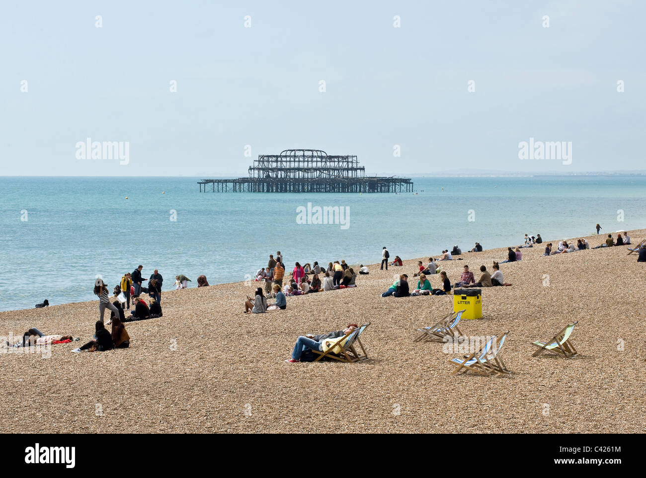 People relaxing on Brighton beach. Stock Photo