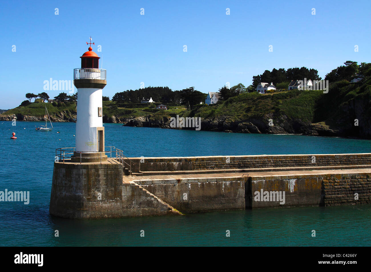 red Lighthouse entrance to the harbour belle-ile Stock Photo