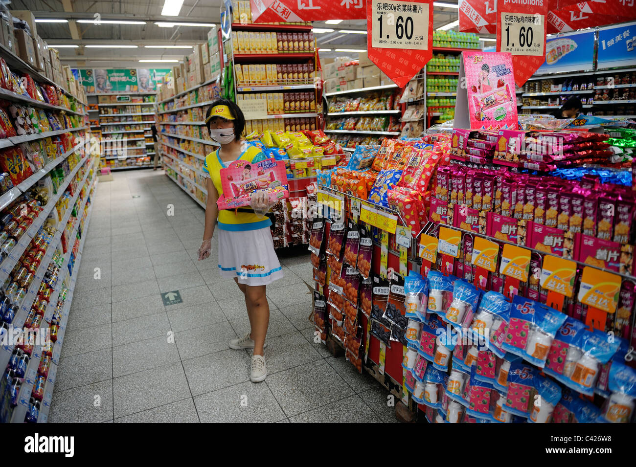 A saleswoman promotes biscuits in Wu Mart supermarket in Beijing, China. 28-May-2011 Stock Photo