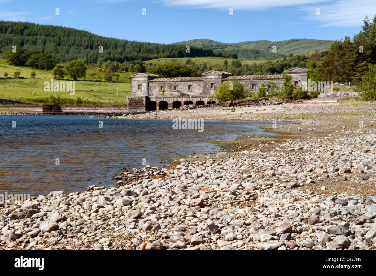 Loch Venachar & pebble beach, Lomond and Trossachs national park Scotland taken on fine summer day and water tower Stock Photo