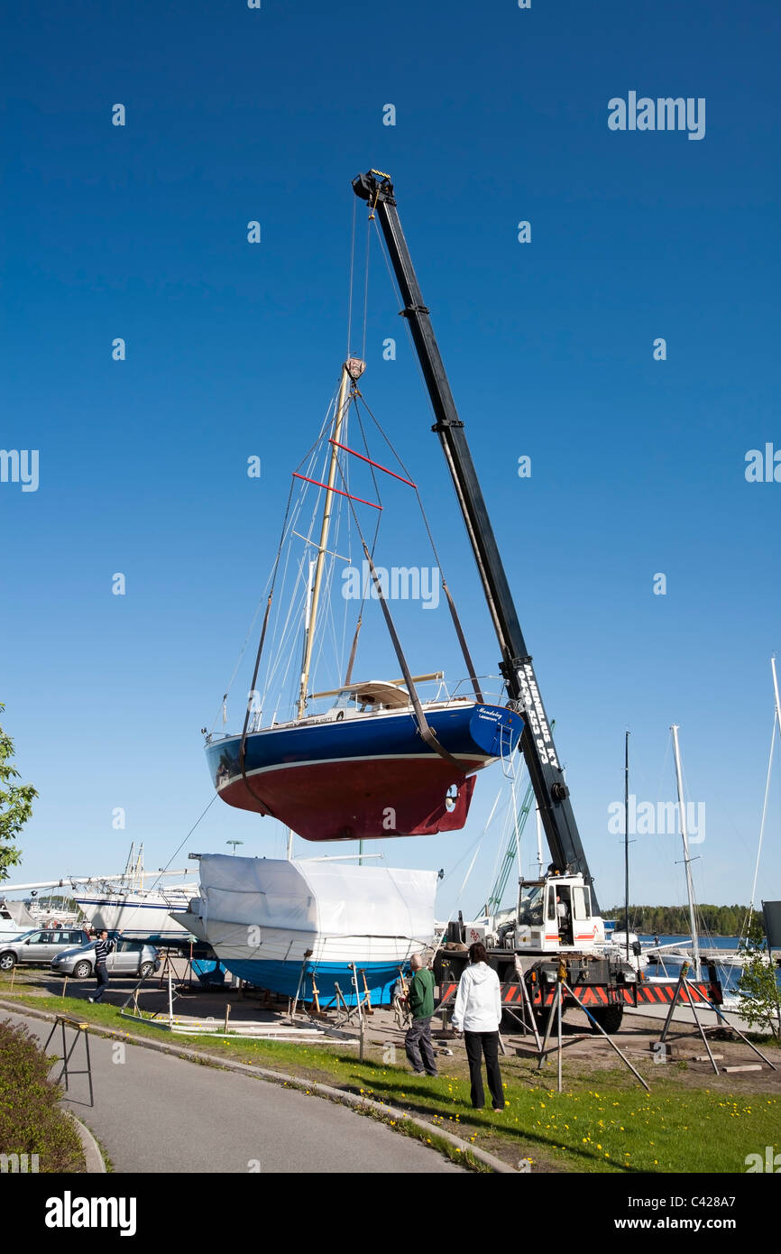 Crane lifting a boat hi-res stock photography and images - Alamy